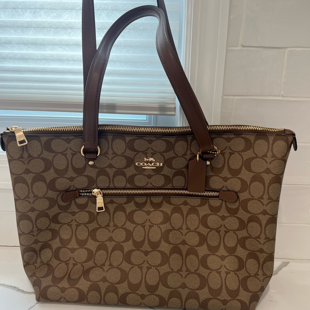Authentic used once coach bag in excellent like new condition